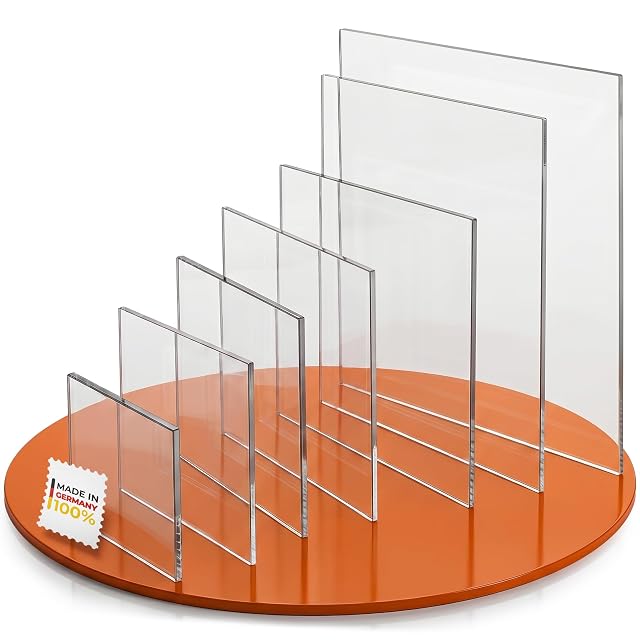 Clear acrylic panels of increasing size standing in a slotted orange base, with a Made in Germany stamp