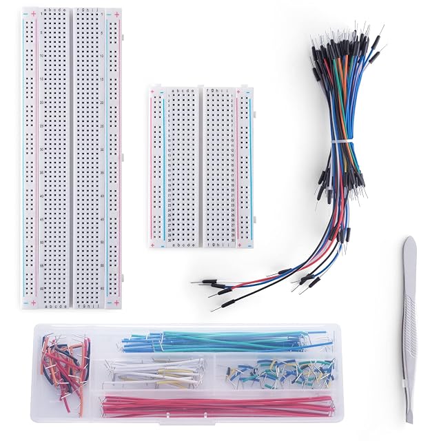 An 830-point and a 400-point breadboard, a bundle of flexible jumpers, a box of colour-coded U-shaped jumpers and tweezers