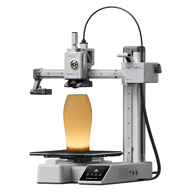 Bambu Lab A1 Mini compact 3D printer shown with a printed lamp shade