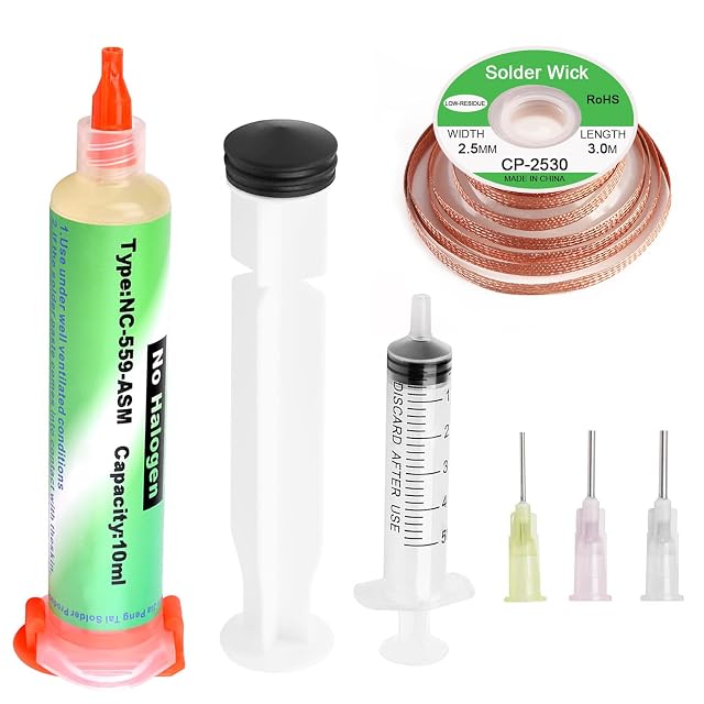 NC-559-ASM 10 ml flux syringe marked no halogen, a plunger, a 5 ml syringe, three needles and a solder wick reel marked 2.5 mm × 3.0 m