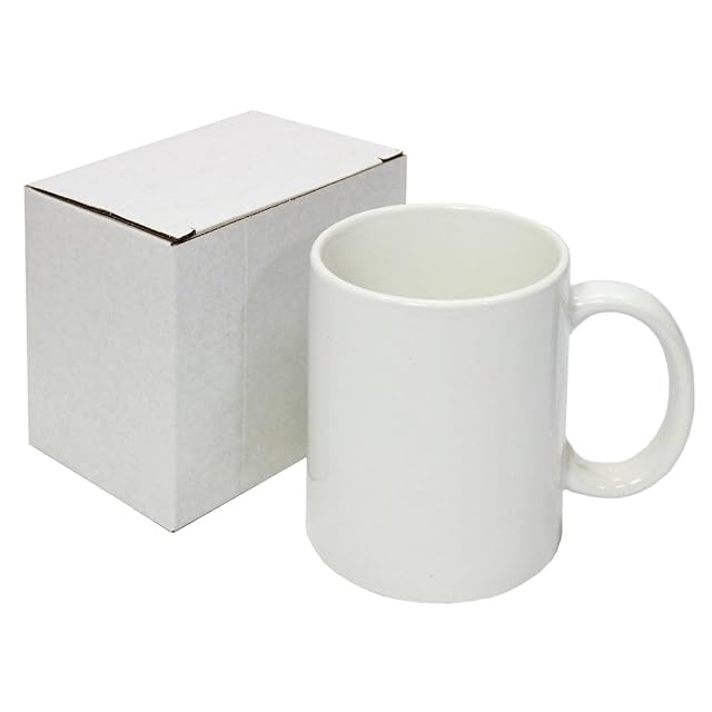White ceramic mug beside a plain white box