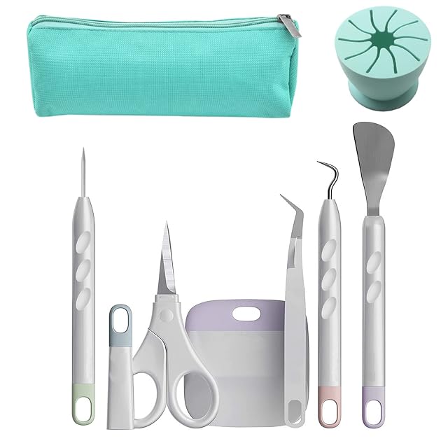 Teal zip bag, a round teal silicone scrap collector, piercing tool, covered scissors, scraper, tweezers, hook and spatula